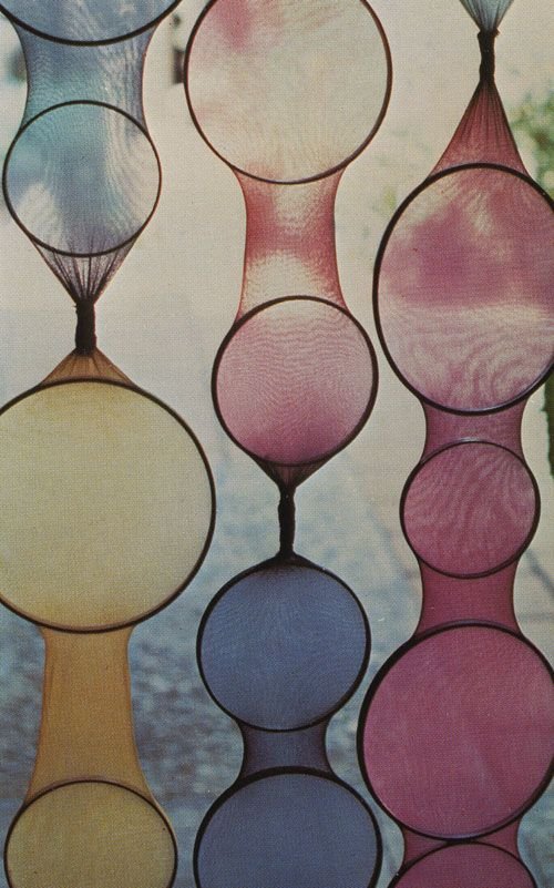 Hose stretched over circular frames and hung as a room divider or window coverings!!: 